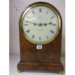 WITHDRAWN A Regency mahogany cased bracket clock having an arched top
