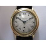 A 1920s/30s 9ct gold gents Harwood automatic wristwatch, the case with serrated rotating bezel for
