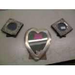 Three Edwardian silver photograph frames, one of a heart shape with engraved initial 'M' to the top,