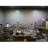 A quantity of silver plate to include a three piece teaset