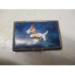 An enamelled box, the lid decorated with a dog, inside is a hand written letter from WW2