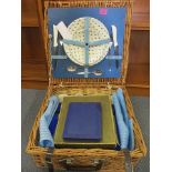 A picnic hamper and silver plated flatware to include a set of six teaspoons, boxed