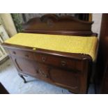 An early 20th century mahogany sideboard with a raised back, two drawers, two cupboards and