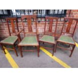 A set of four late 19th century oak Art Nouveau chairs, comprising three standards and one carver,