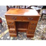 A reproduction yew wood, knee hole desk, 31 h x 30 w