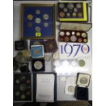 A selection of commemorative coins, proof sets to include a cased silver Polytechnic School of Art