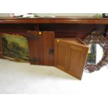 An oak corner cabinet, a wooden door of plank construction with iron work hinges and door handle, an