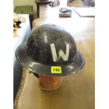 A WWII wardens tin plated helmet
