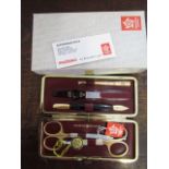 A 24ct gold plated, Solingen manicure set together with a boxed Harrods glass perfume bottle