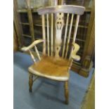 An elm seated, leather back country armchair