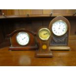 A group of three Edwardian inlaid mahogany cased mantle clocks to include a small balloon shaped