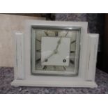 An Art Deco Garrard painted mantle clock