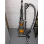 A Dyson DC 25 upright vacuum cleaner