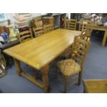 A Furniture Village pale oak refectory table having a planked top, raised on turned block legs, 30