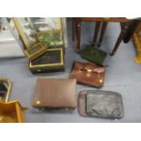 A mixed lot to include metal cash tins, cases, pictures and a suitcase