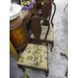 A pair of 1920s mahogany framed child's splat back chairs, raised on cabriole fore-legs