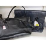 A modern Dents leather ladies handbag, in navy, new with tags together witha Jaeger handbag in black