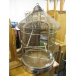 A mid 20th century metal framed dome topped bird cage, 30 h