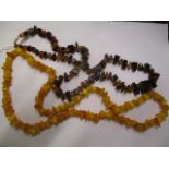 Two amber necklaces to include a Baltic amber necklace with a 9ct gold clasp