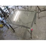 A modern wrought steel glass topped square table, 23 3/4 h, 27 w