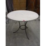 A modern wrought steel, marble topped table, 31 h, 53dia