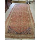 A Turkish red ground runner with triple guard border, 5'6 x 11'6