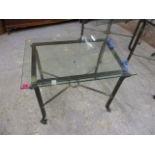 A modern wrought steel glass topped square table, 19 1/2h, 27 w