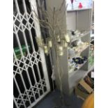 A modern textured and painted metal candle stand fashioned as a tree and seven candleholders, 75 h