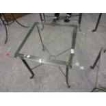 A modern wrought steel glass topped square table, 23 3/4 x 28 1/2