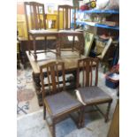 A 1930s oak table, having twin bolbous carved columns, raised on block feet, 30 1/2h, 42 1/4w, 42d