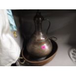 A Victorian copper and brass, twin handled cooking pot, together with an Eastern copper urn