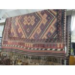 An Afghan Kelim Aztec design rug, brown ground with tassels, 103 x 79