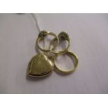 Three 9ct gold rings to include a wedding band and a locket