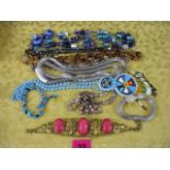 Venetian glass bead necklaces and others, bracelets, and a small beaded purse