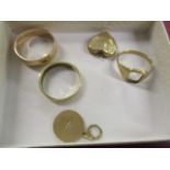 Three 9ct gold rings, a pendant and a locket