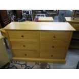 A modern light oak chest of six short drawers, 35 h x 52w