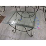 A modern wrought steel, rectangular, glass topped table, 16 3/4 x 30