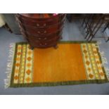 A Wanda Kossecka Kelim rug, orange and yellow with green border