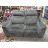 A two seater sofa and two seater companion with adjustable backs, upholstered in a dark grey suede