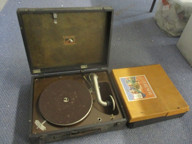 A His Masters Voice gramophone, together with mixed records