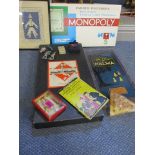 Vintage games to include Monopoly, together with a modern needlepoint, framed