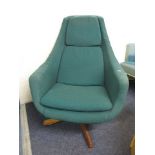 A mid 20th century, green upholstered, swivel armchair on a teak framed base