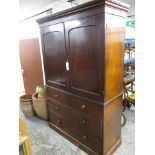 A Victorian mahogany linen press having a cushion moulded cornice, twin panelled doors with two