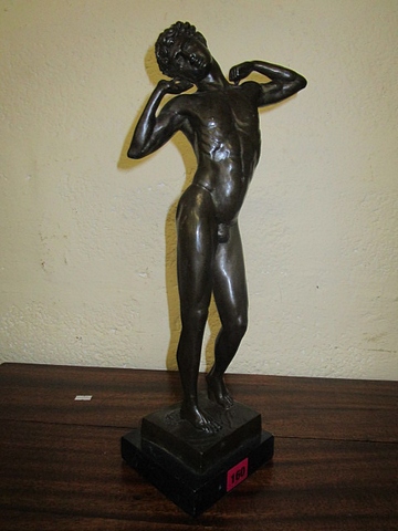 A contemporary bronze nude male figure, mounted on a black square base, 17 high