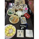 Vintage costume jewellery to include stained shells, vintage necklaces, brooches, a glass dressing