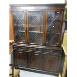 A reproduction mahogany side cabinet, the dentil moulded cornice over three astragal glazed