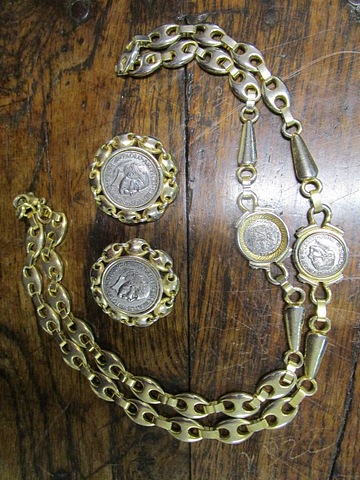 A gold plated and white metal Gucci coin necklace and matching clip earrings