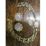 A gold plated and white metal Gucci coin necklace and matching clip earrings