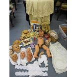 Vintage dolls' component parts to include nine dolls' heads, an early Victorian child's cape,