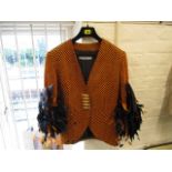 Circa 1970 - a Christian Dior Boutique ladies jacket in orange and black herringbone design with